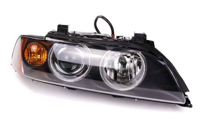 BMW Headlight Assembly - Passenger Side (Xenon) 63126912434 - Hella 008052901